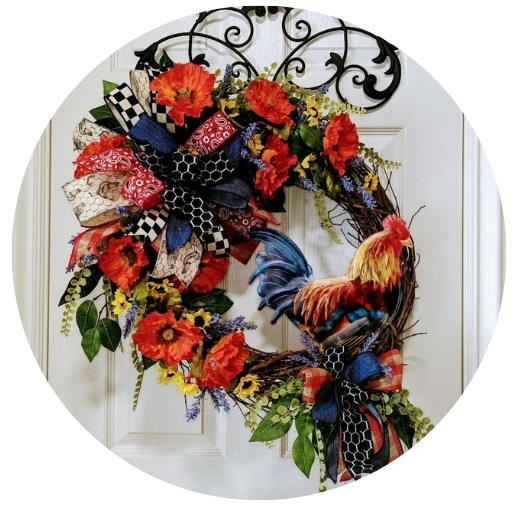 colorful rooster on grapevine wreath with orange poppies
